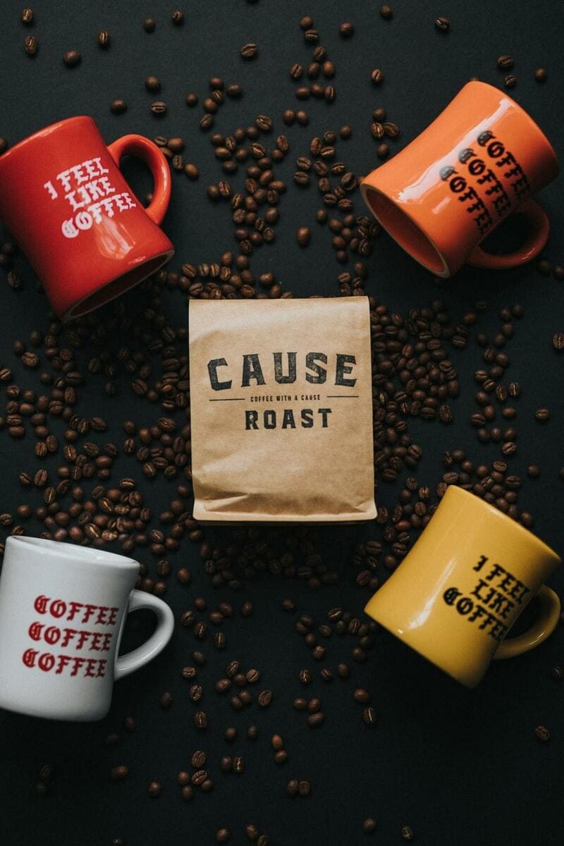 coffee beans near mugs