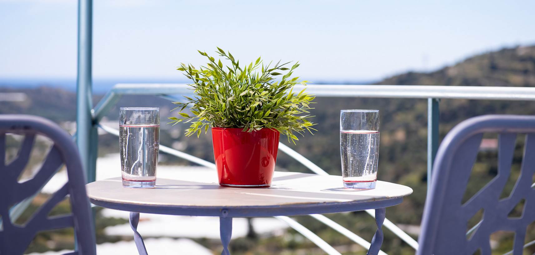 Sarakinas Residence, balcony with a table and panoramic view