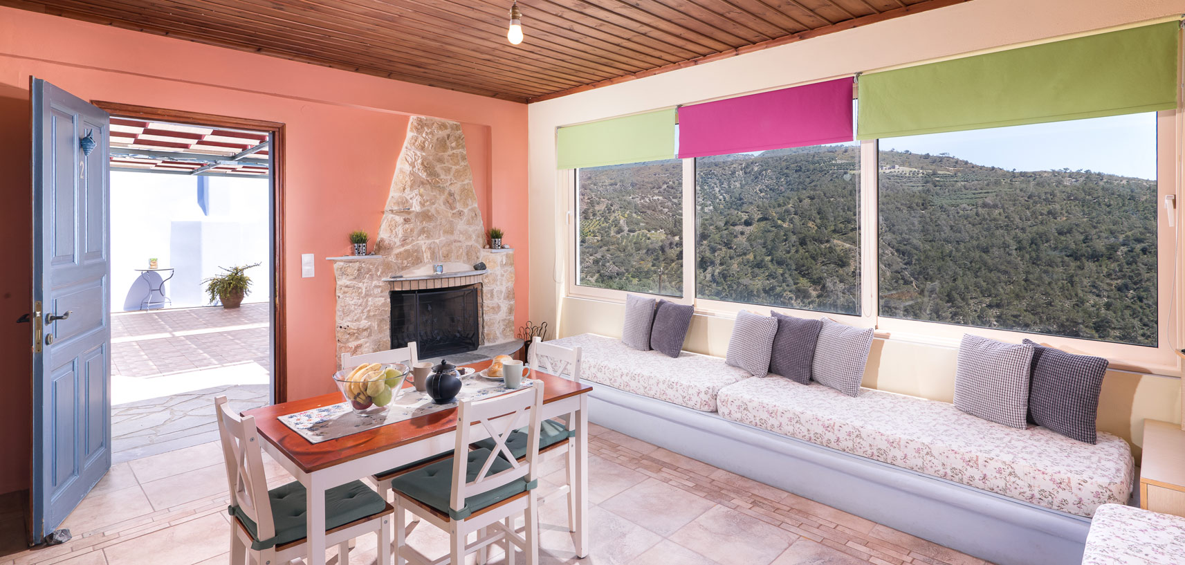 Sarakinas Residence, living room with a table and a fireplace