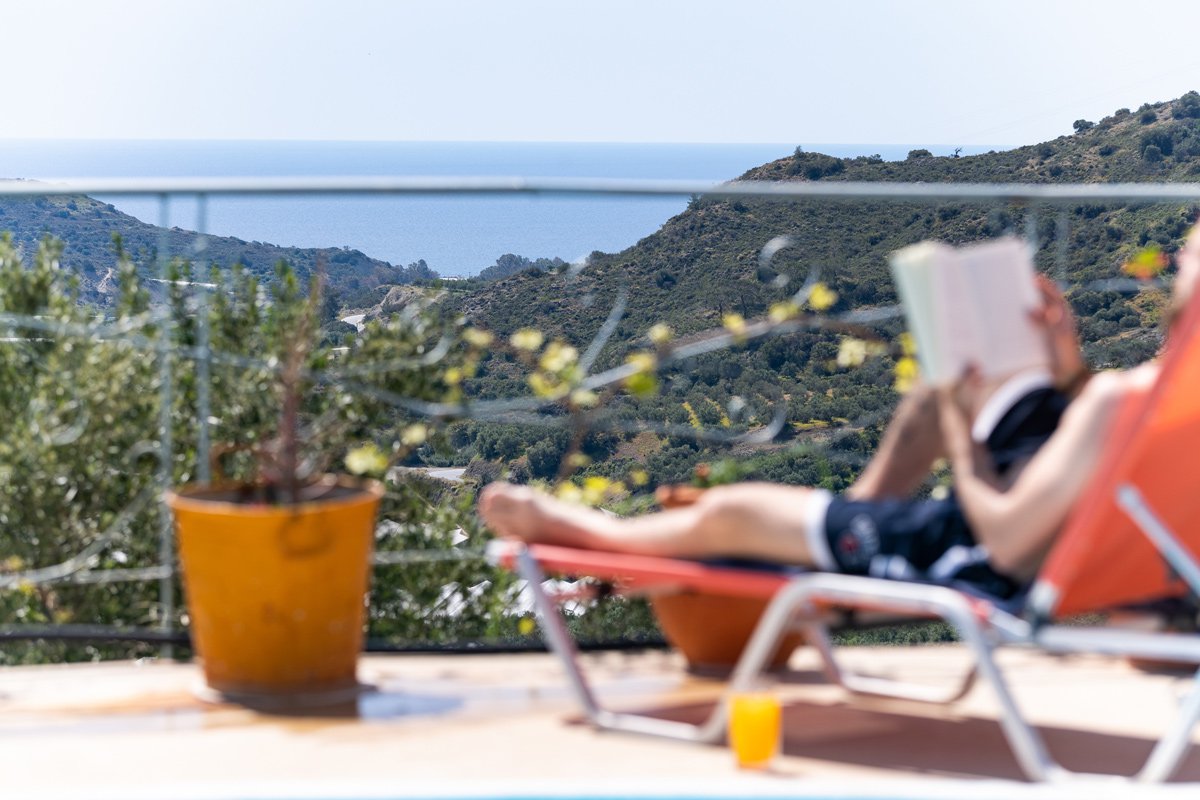 Sarakinas Residence, reading by the pool