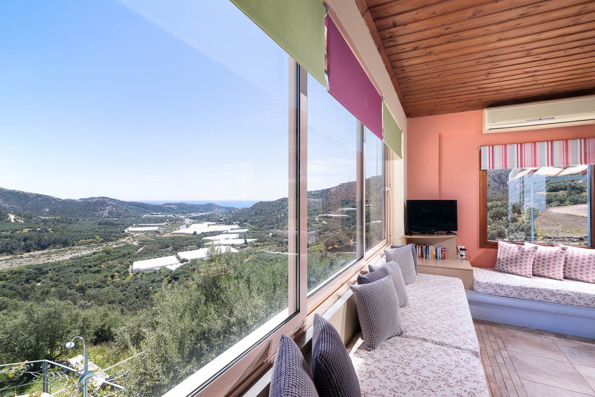 Sarakinas Residence, living room with windows and panoramic view