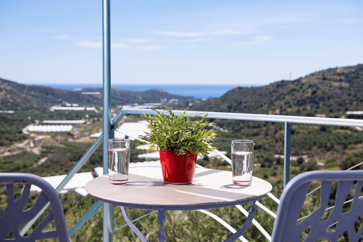 Sarakinas Residence, balcony with a table and panoramic view