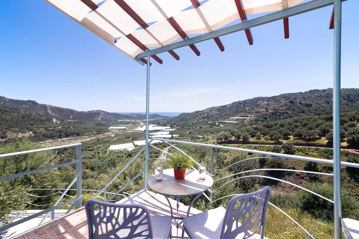 Sarakinas Residence, balcony with a table and panoramic view