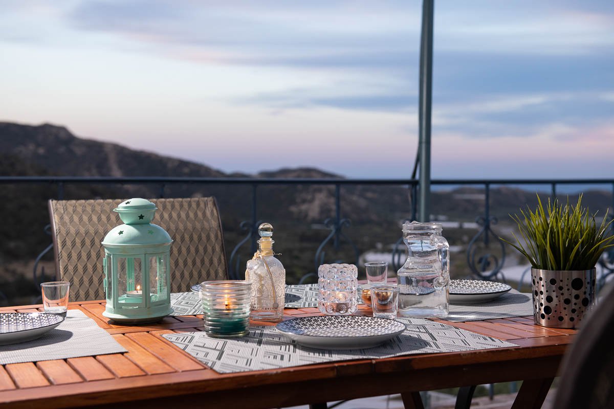 Sarakinas Residence, balcony with a table and panoramic view