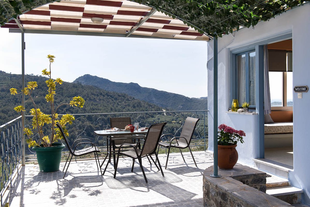 Sarakinas Residence, balcony with a table and panoramic view