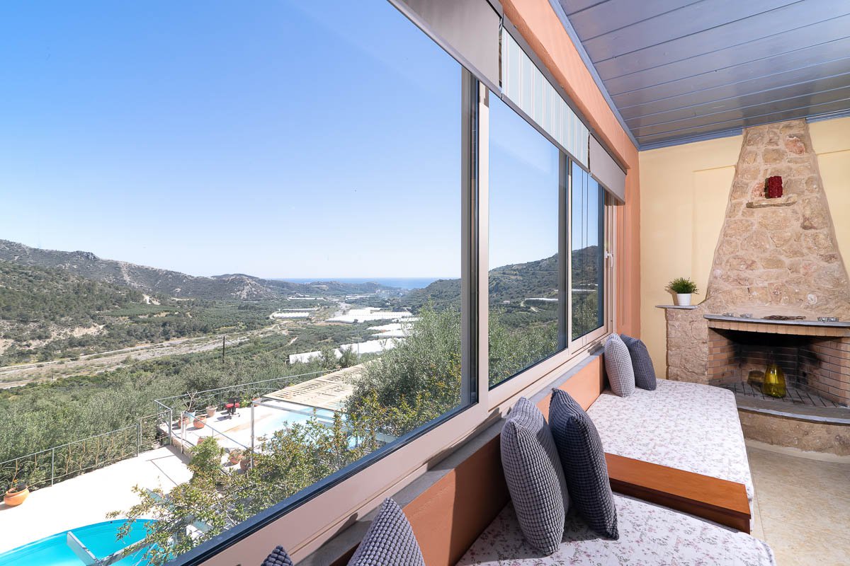 Sarakinas Residence, living room with windows and panoramic view