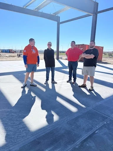 Wagner family with Howard Kool inside the building under construction
