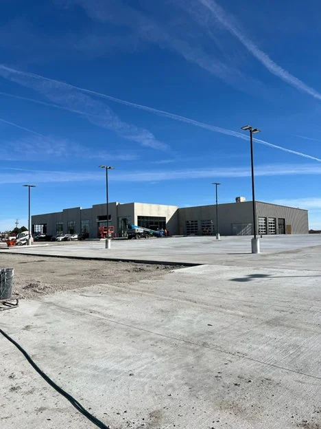 Wide view of the construction site with paved areas