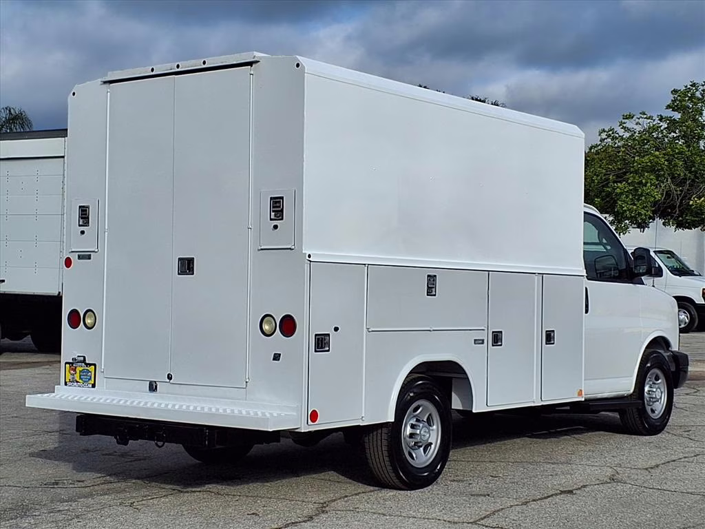 A service van outfitted with ladders and roof racks