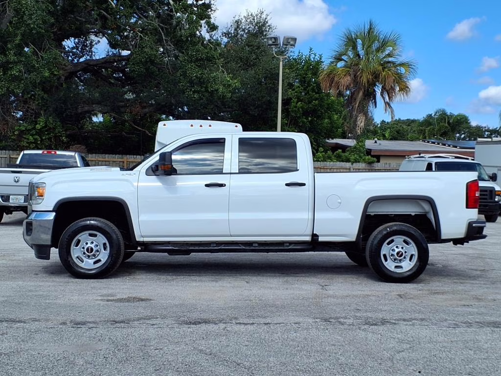 A heavy duty diesel pickup truck parked on a job site.