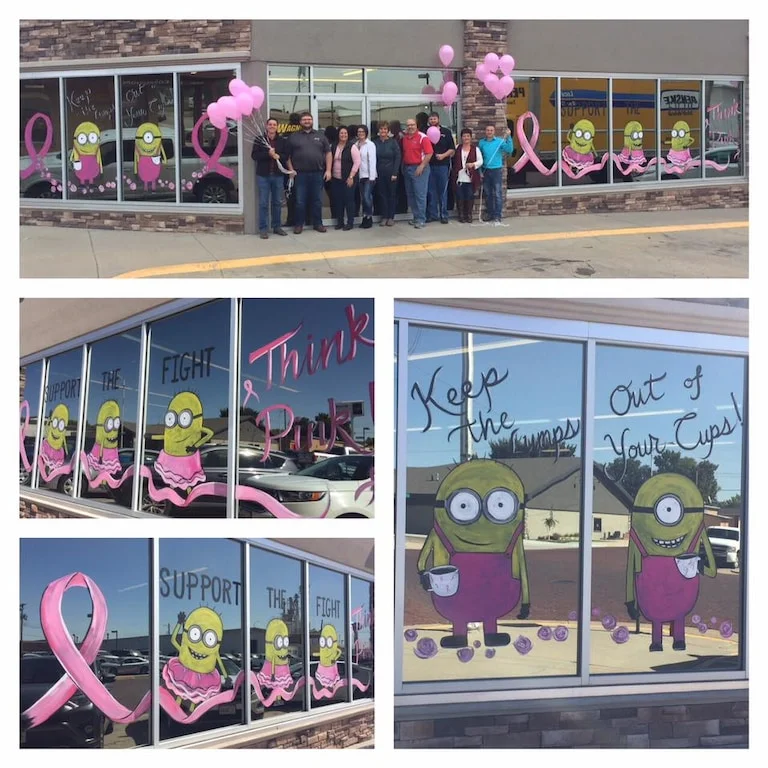 Wagner Ford-Toyota window paintings with pink ribbon designs and minion characters