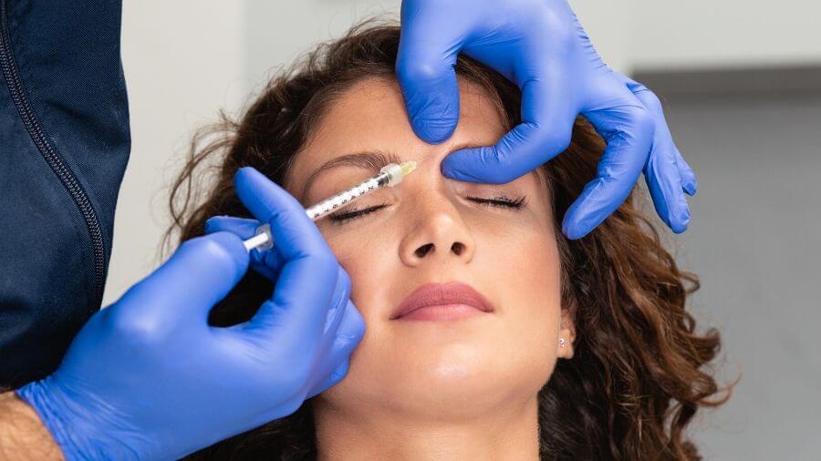 A woman receiving Botox treatment