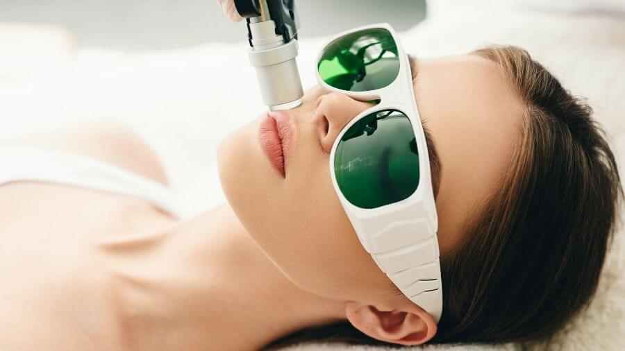 A woman undergoing a laser hair removal procedure