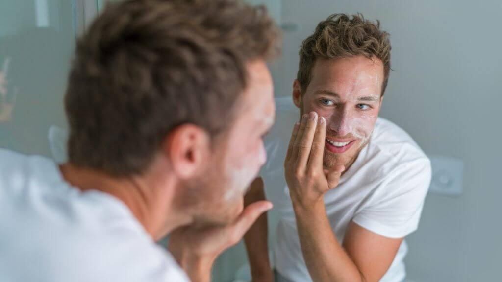 A man cleansing his face