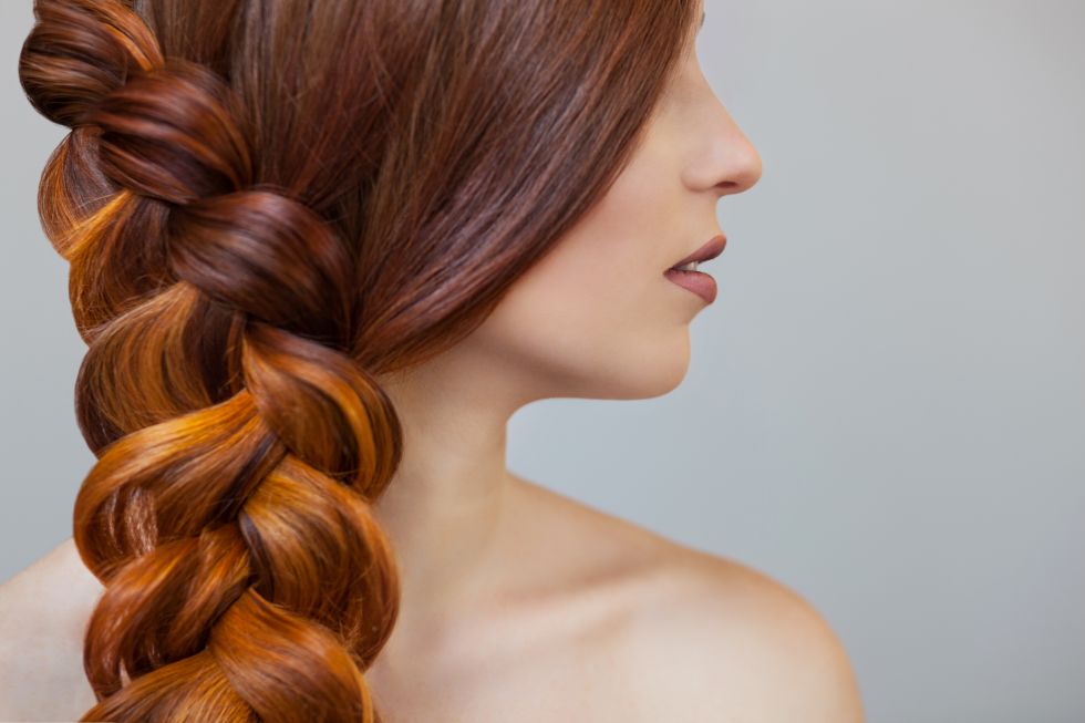 a woman with her hair blowing in the wind