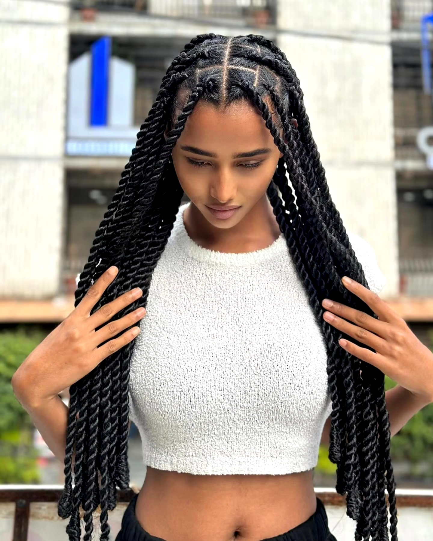 A black woman wearing sincerely4u's Classic Box Braids