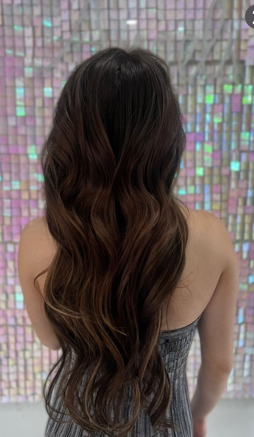 a picture of a woman wearing nano ring hair extensions