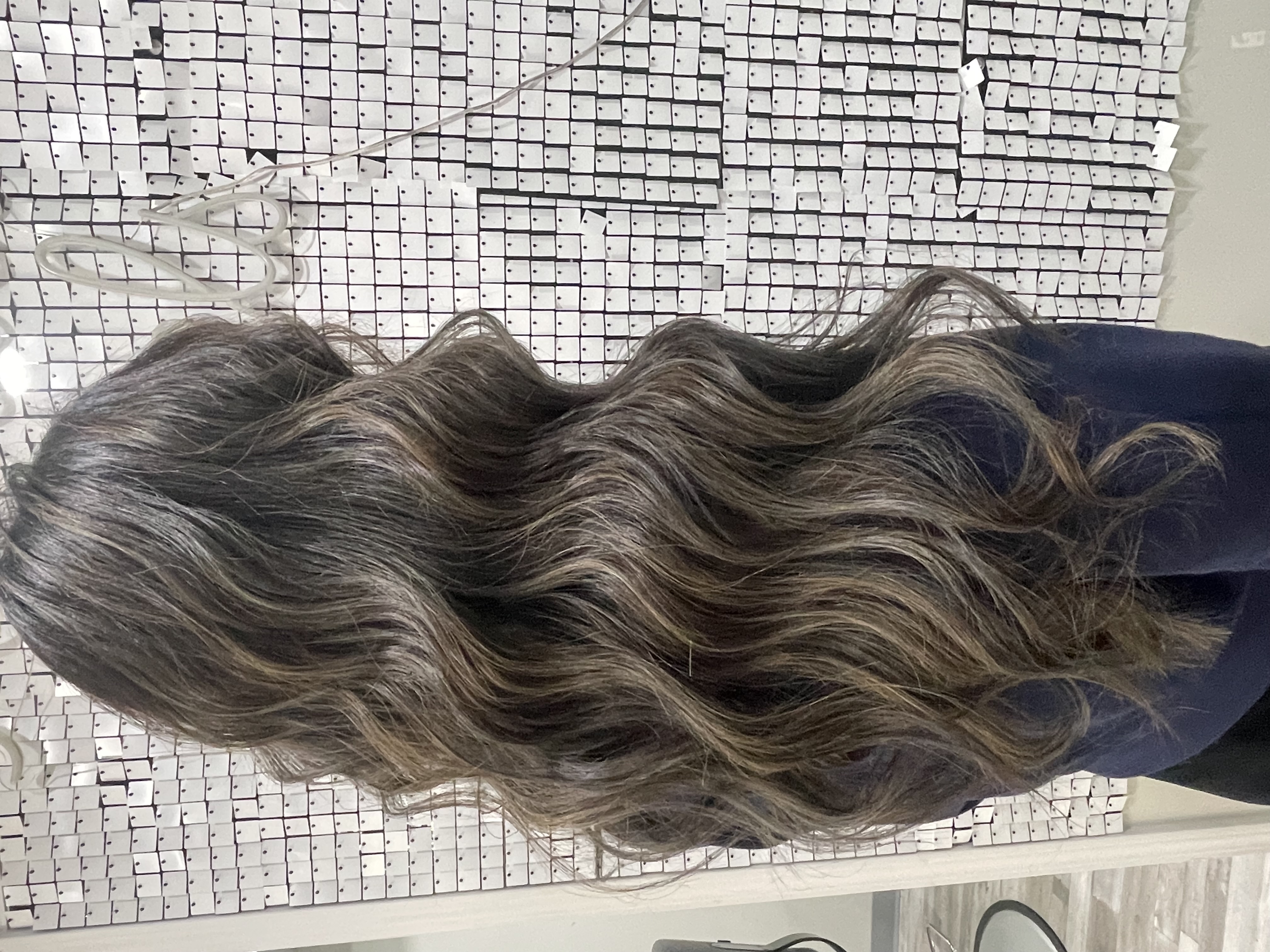 a woman wearing hair extensions at Noelle Salon of Boston