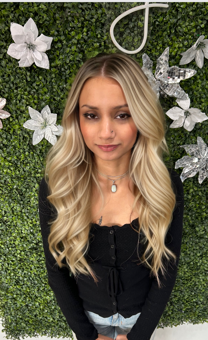 a woman wearing 100 grams of hair extensions