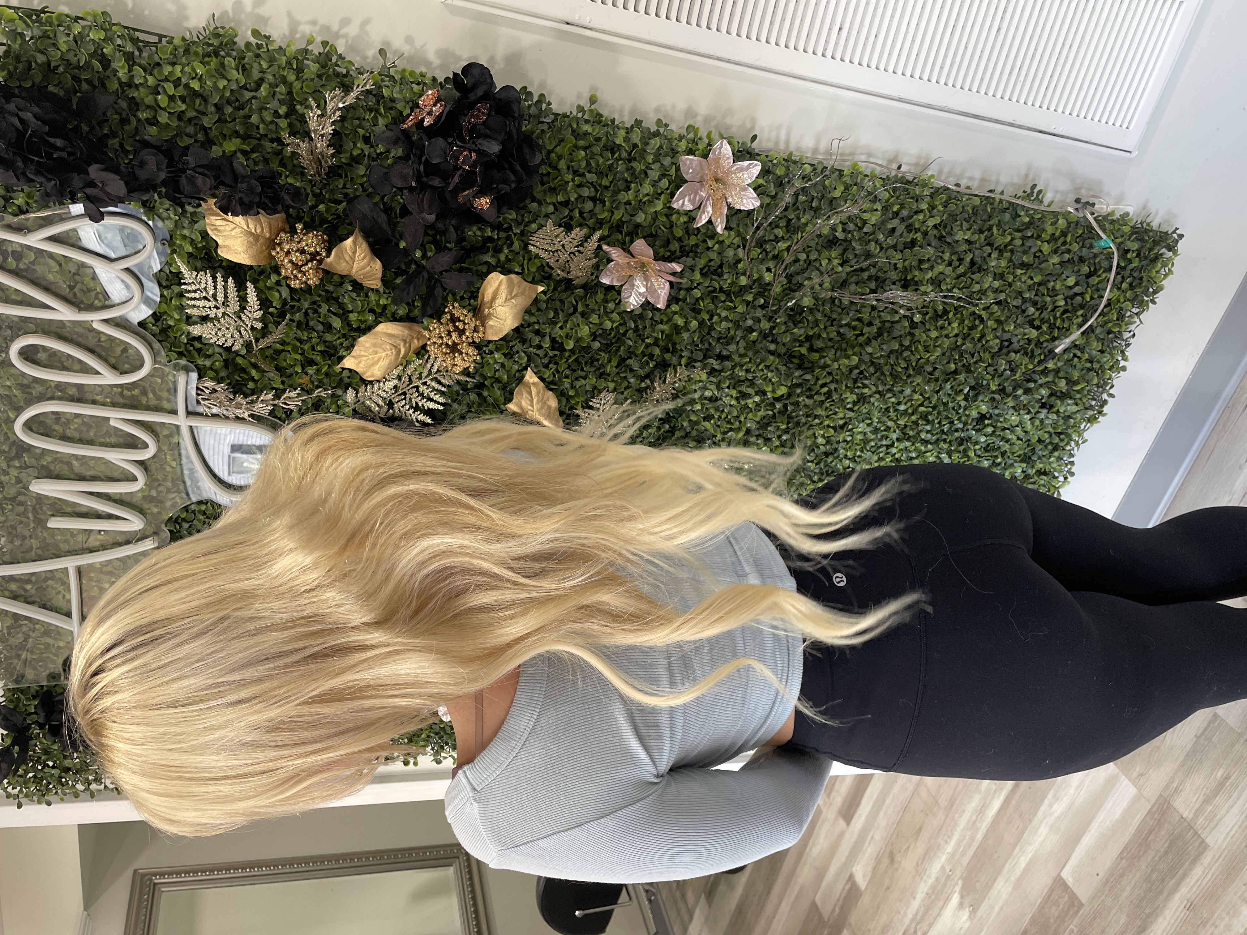 a woman with long blonde hair extensions