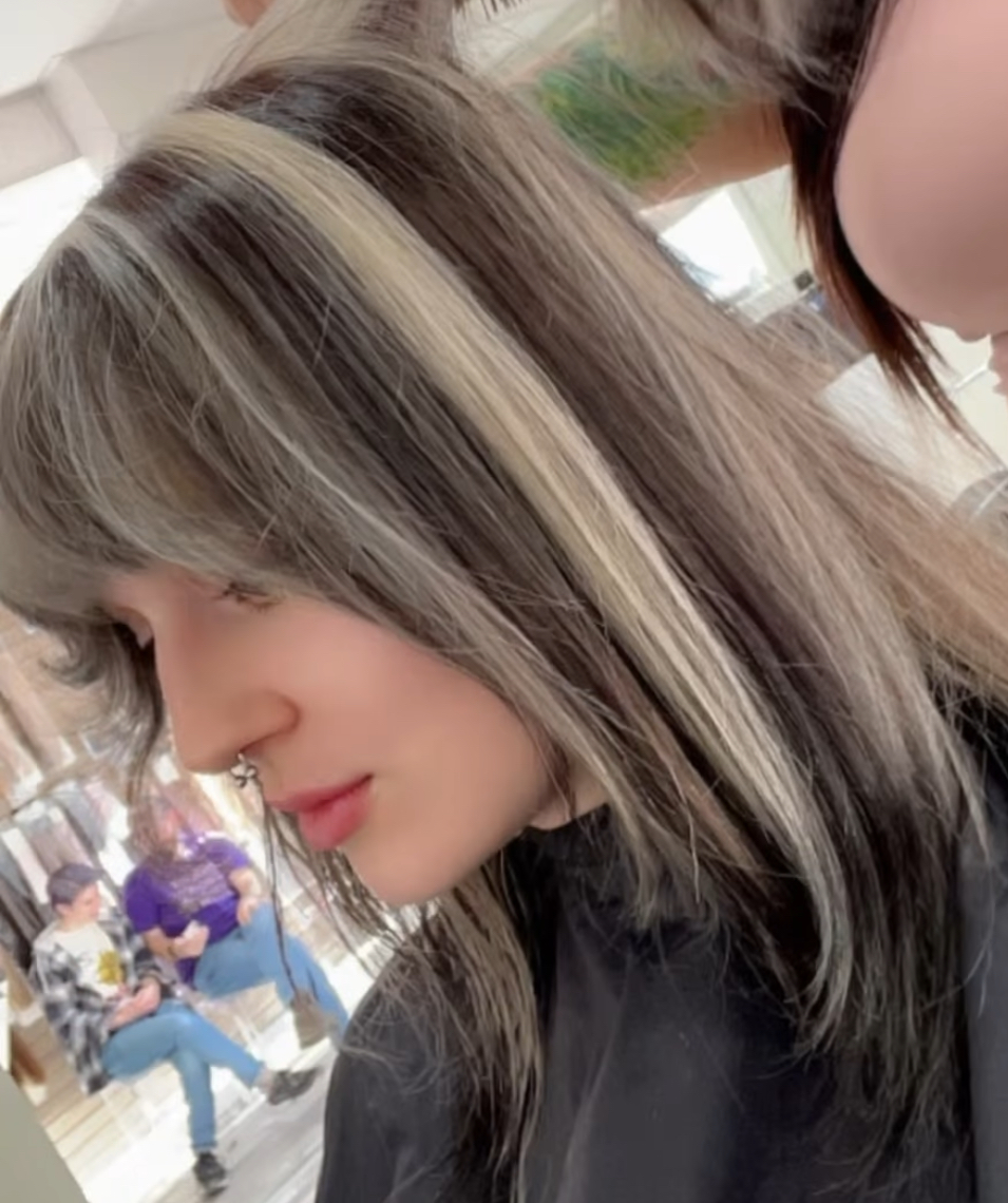 a woman with Sabrina Carpenter style bangs