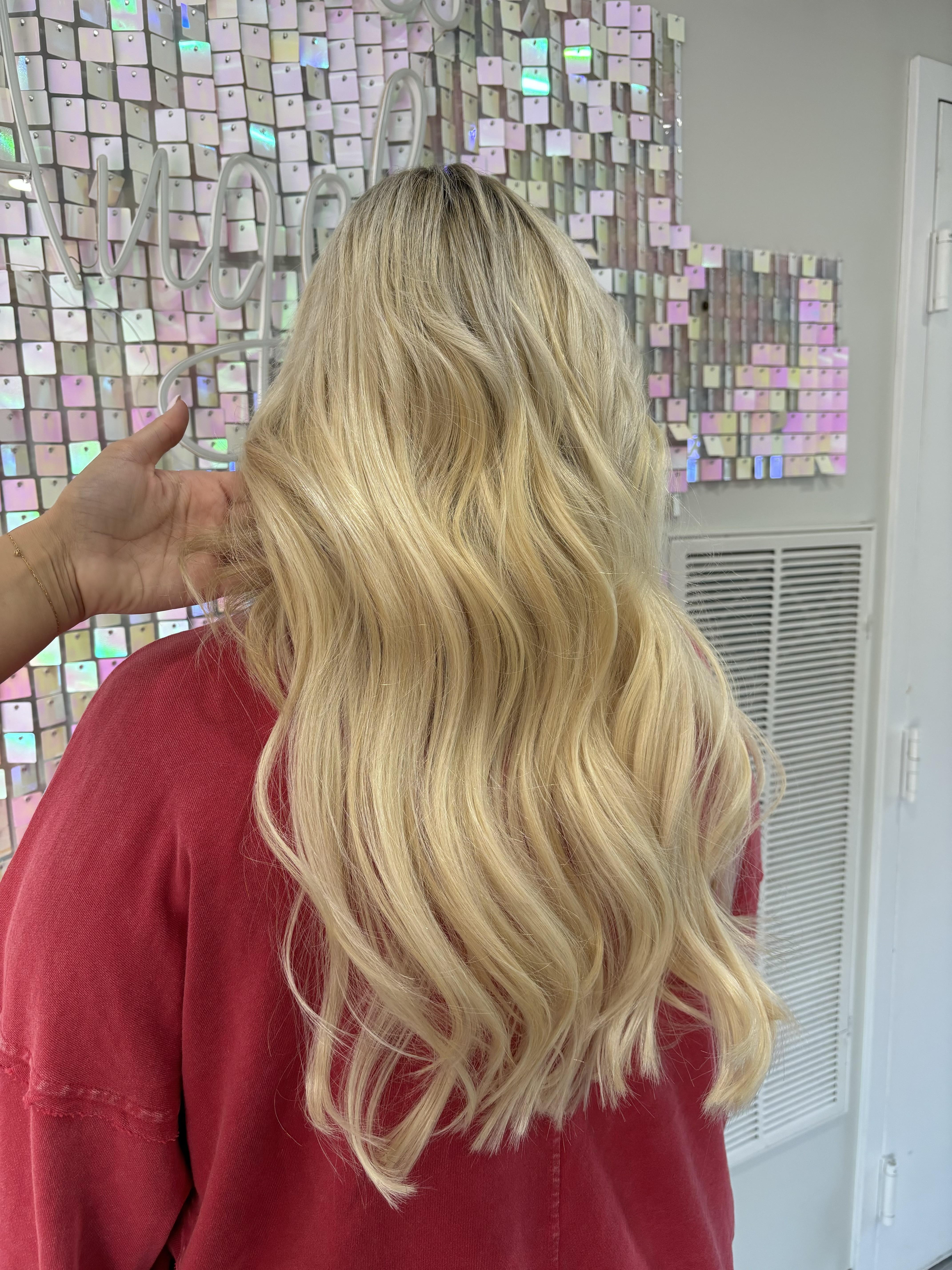a photo of a woman wearing a microline hair topper