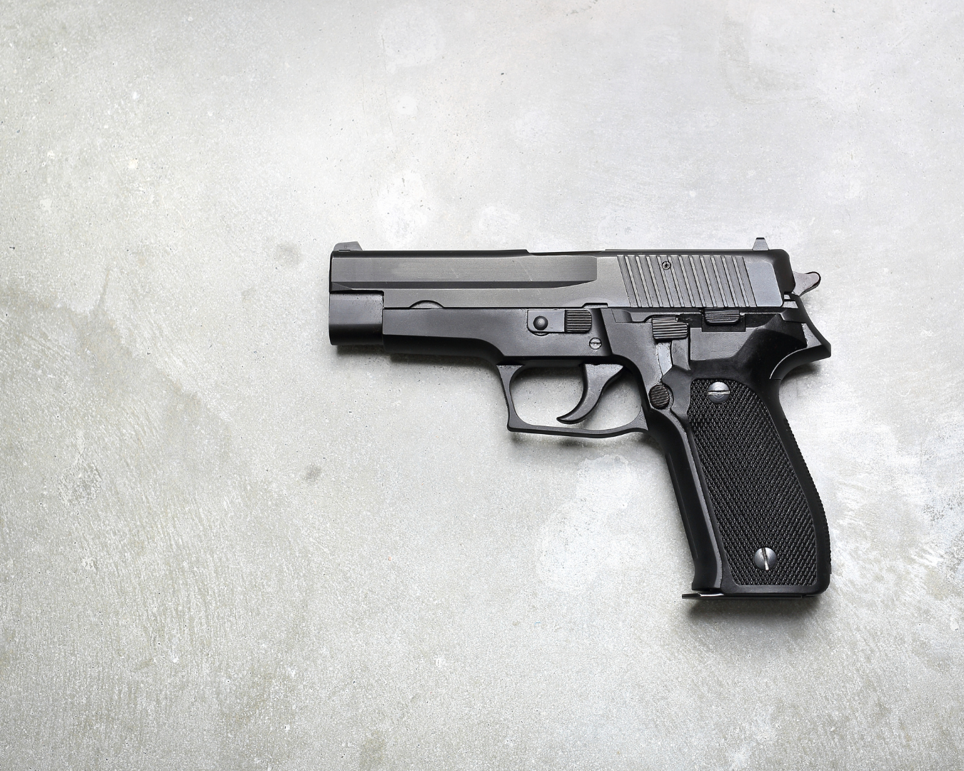 Gun on a grey background