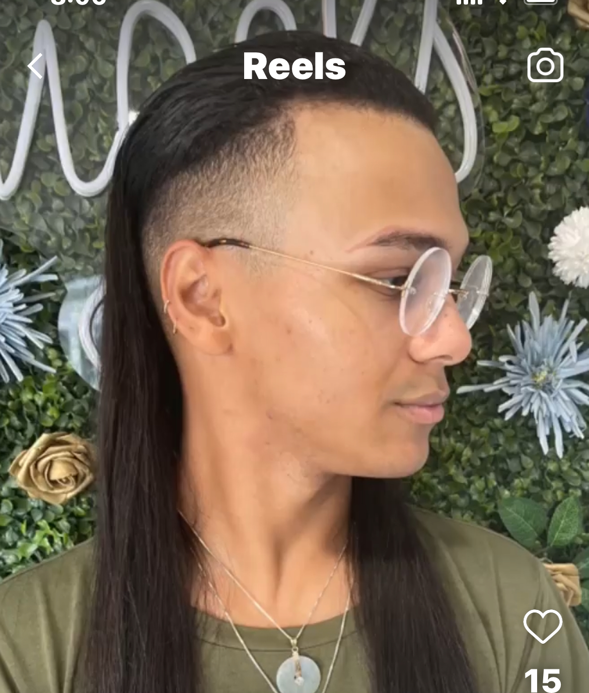 a female to male trans woman  with a long mullet with hair extensions