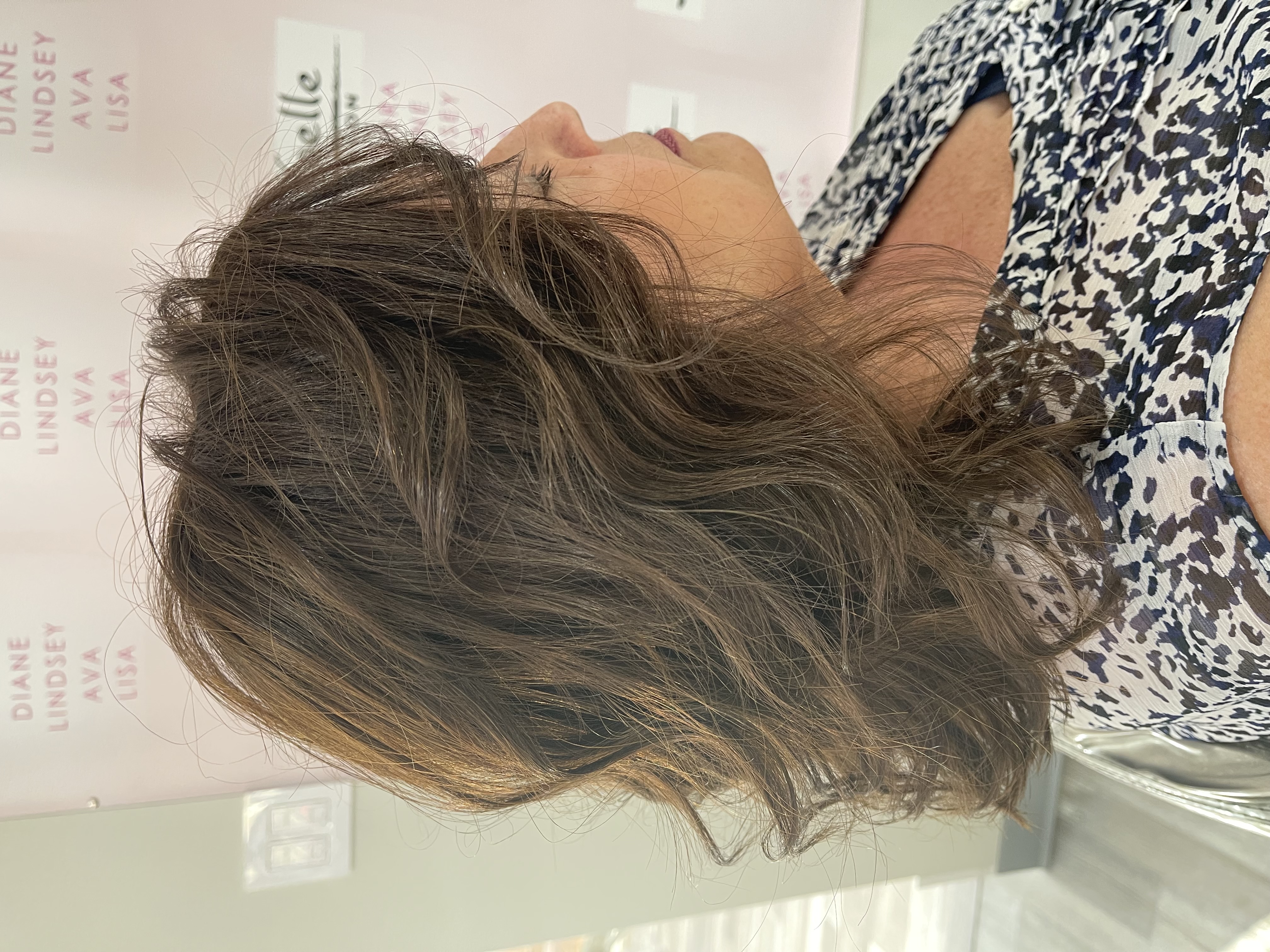 a woman wearing a natural looking hair topper