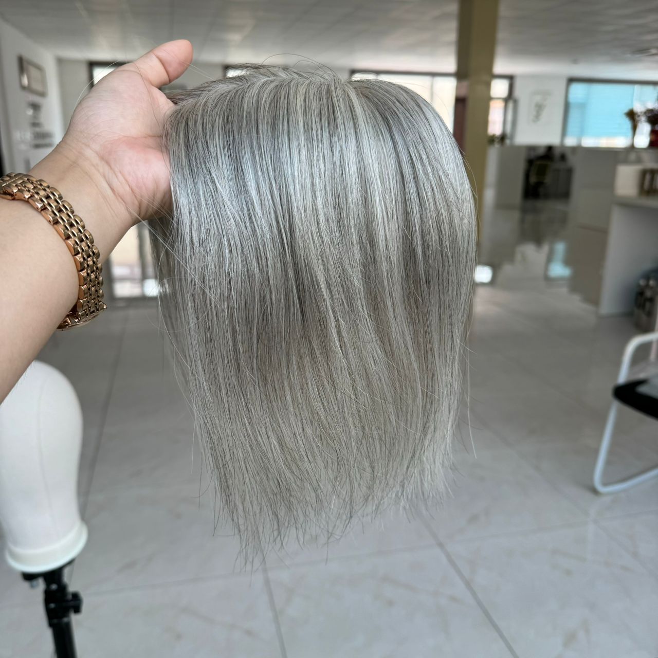 a skin base hair topper in grey hair color