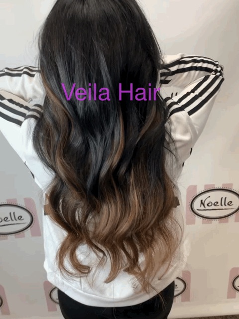a woman wearing Bellami Infinity Weft Hair Extensions