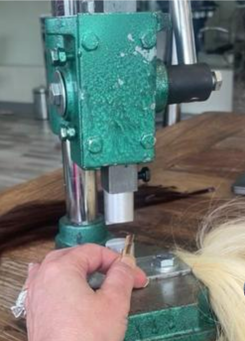 a photo of the owner of Noelle Salon Boston making keratin bond hair extensions