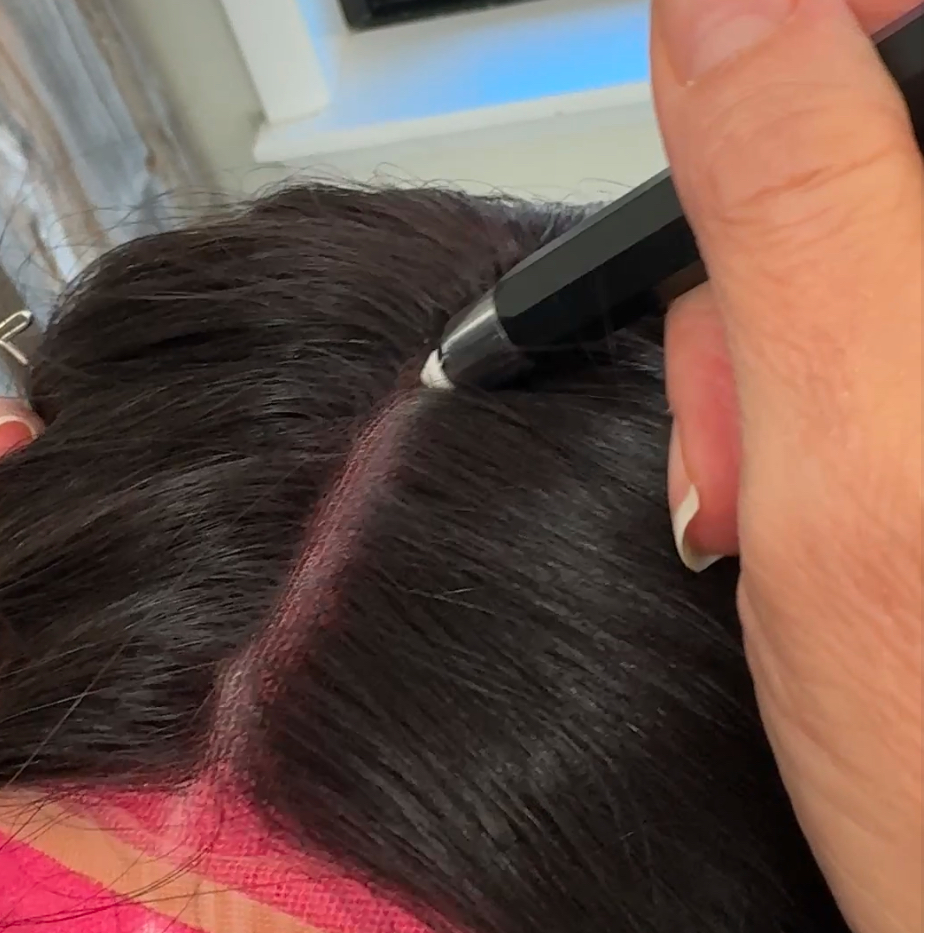 a woman using a knot blur pen