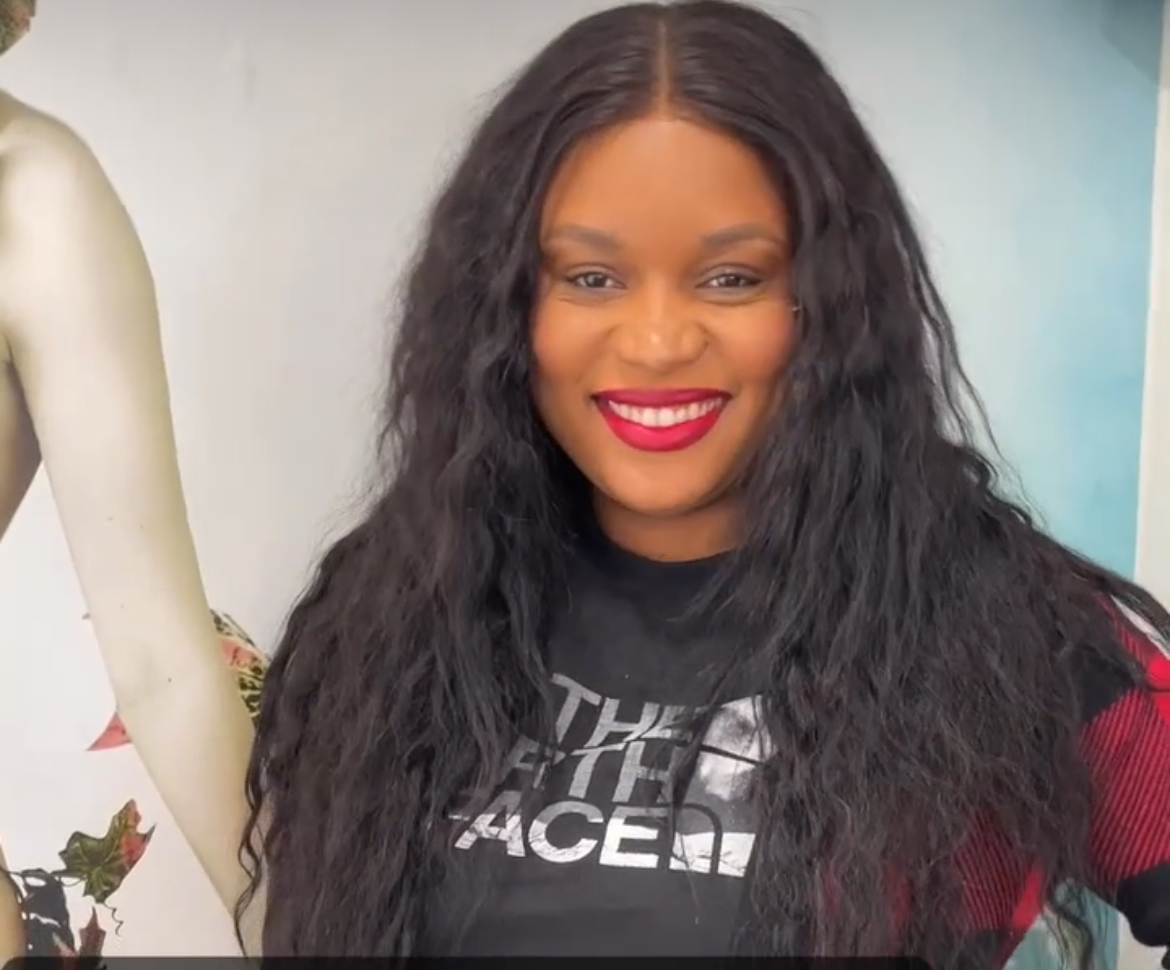 a woman with natural hair in black color with hair extensions