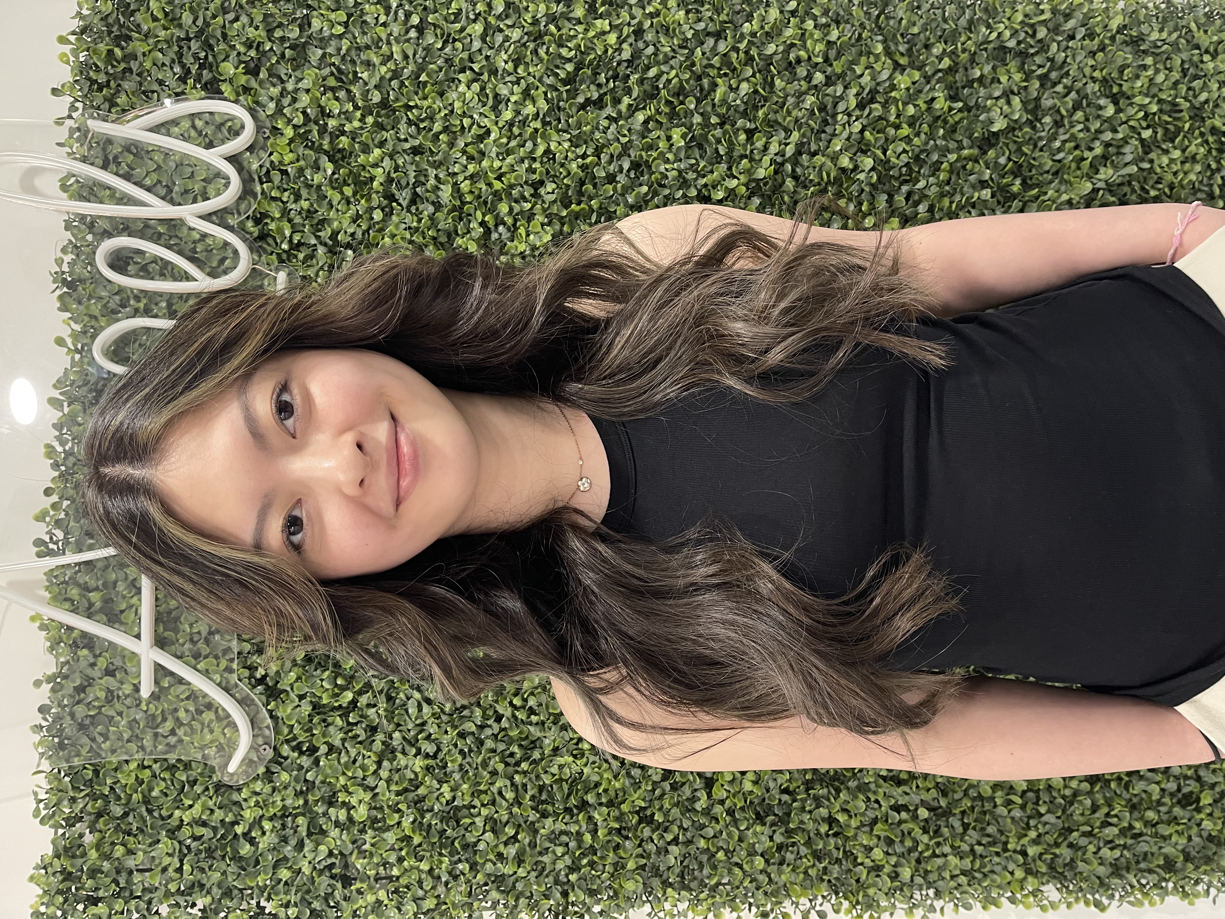 a Boston woman wearing hair extensions applied the same day as her appointment
