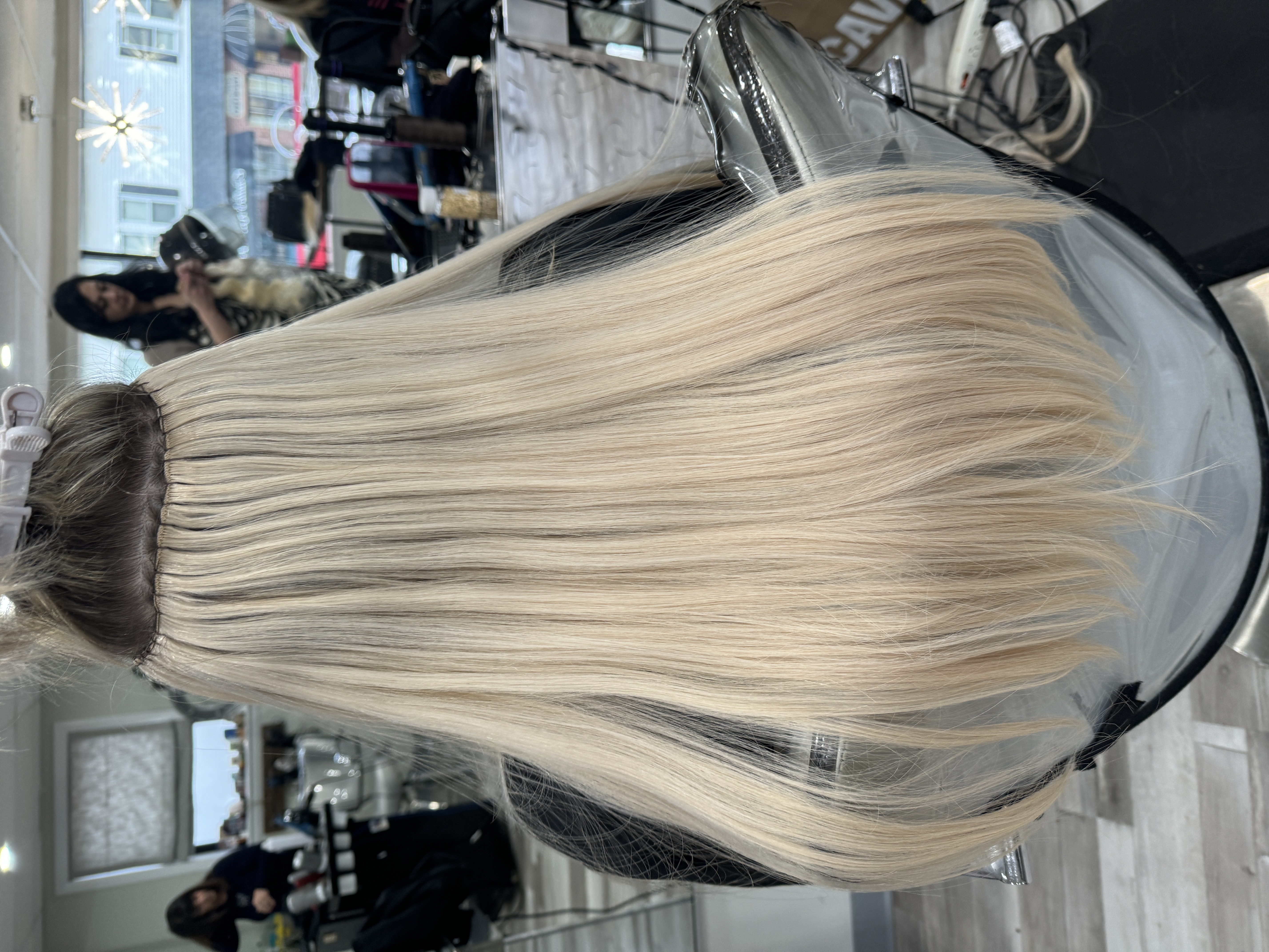 a close up look at beaded sew in hair extensions
