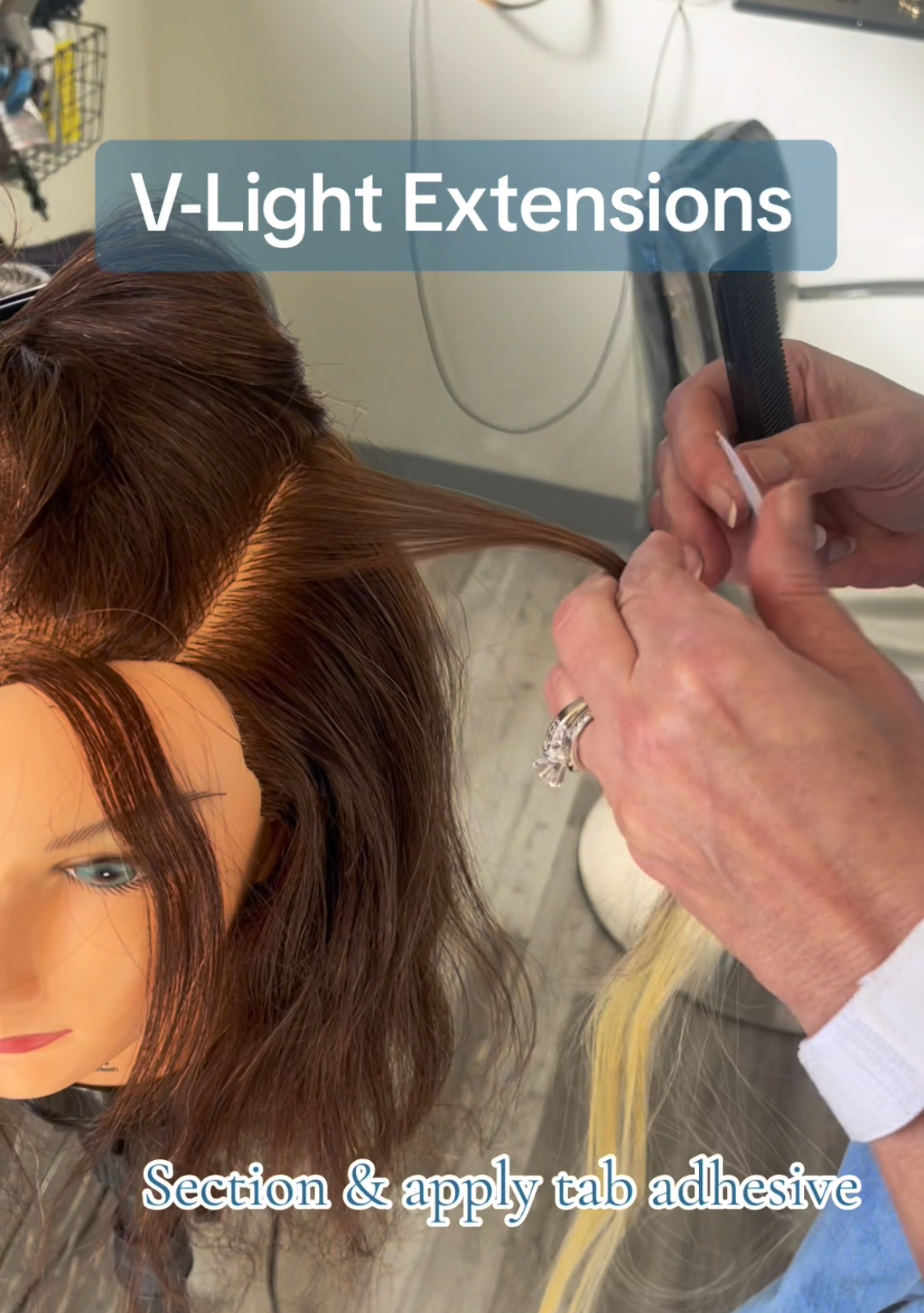 a hairstylist applying v light hair extensions