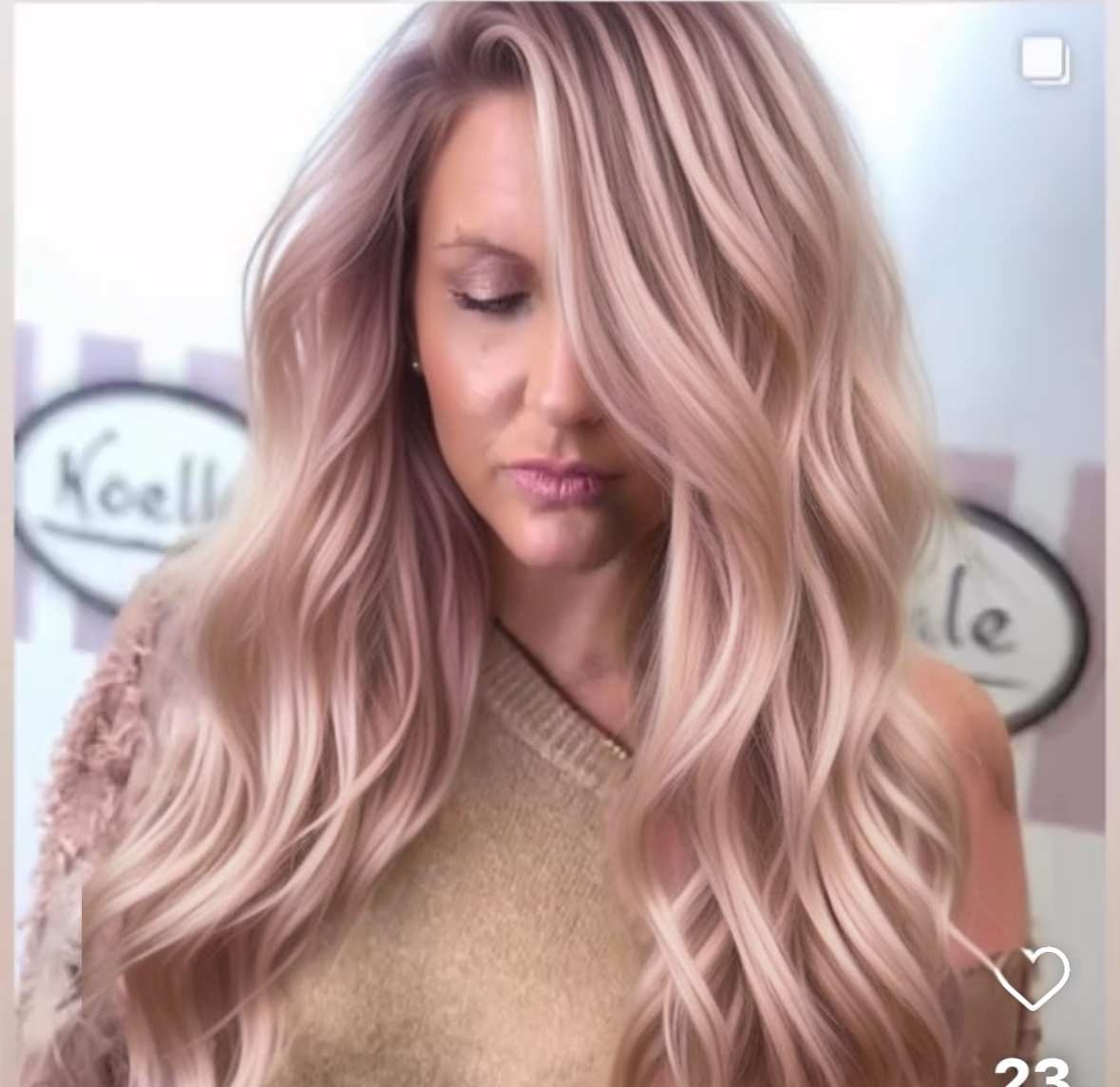 a woman with blush pink hair extensions