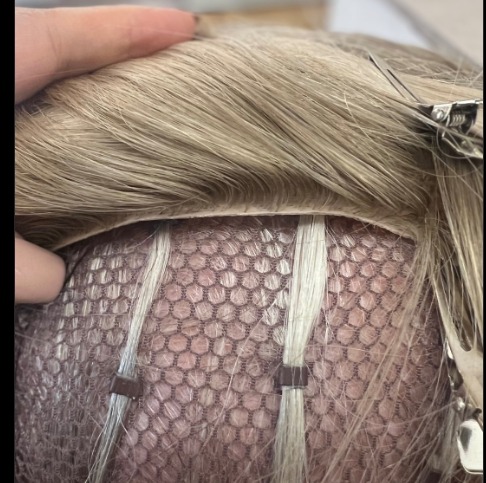 a fishnet integrated hole hair topper