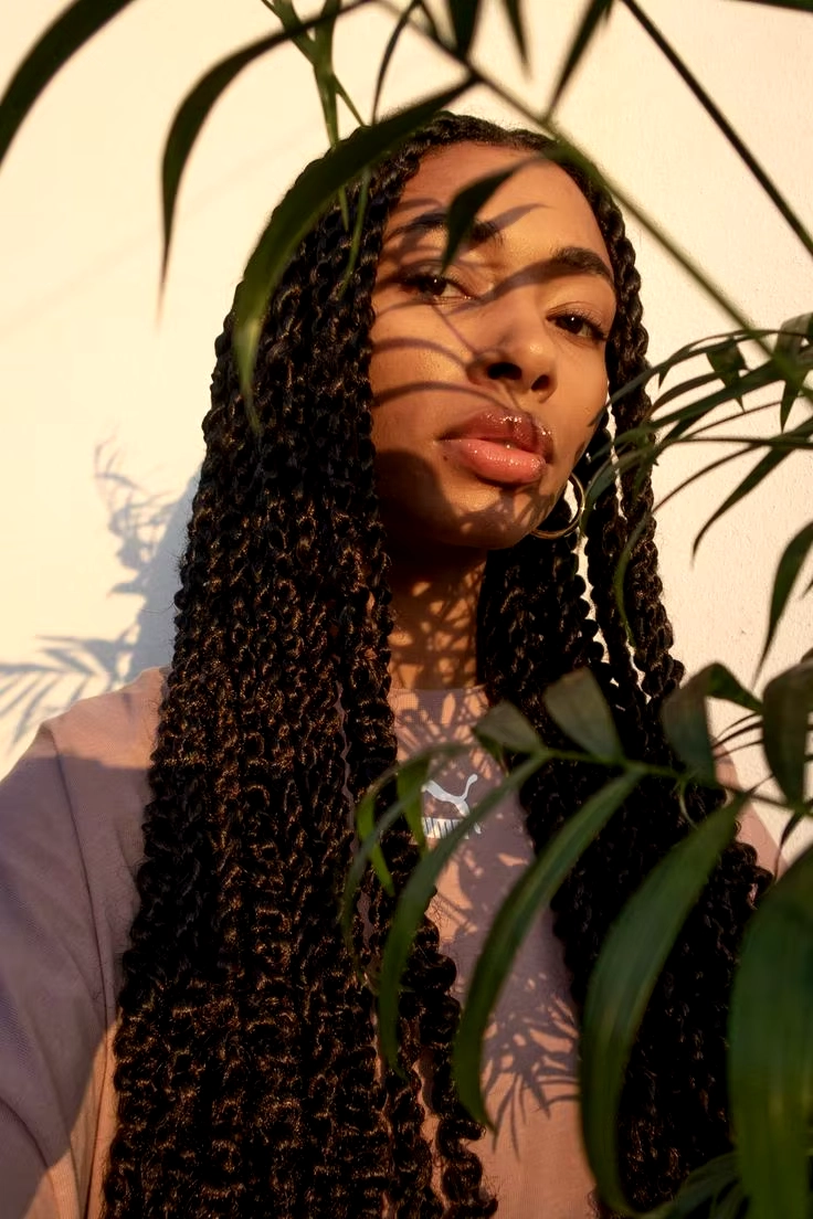 A black woman wearing sincerely4u's Knotless Braids