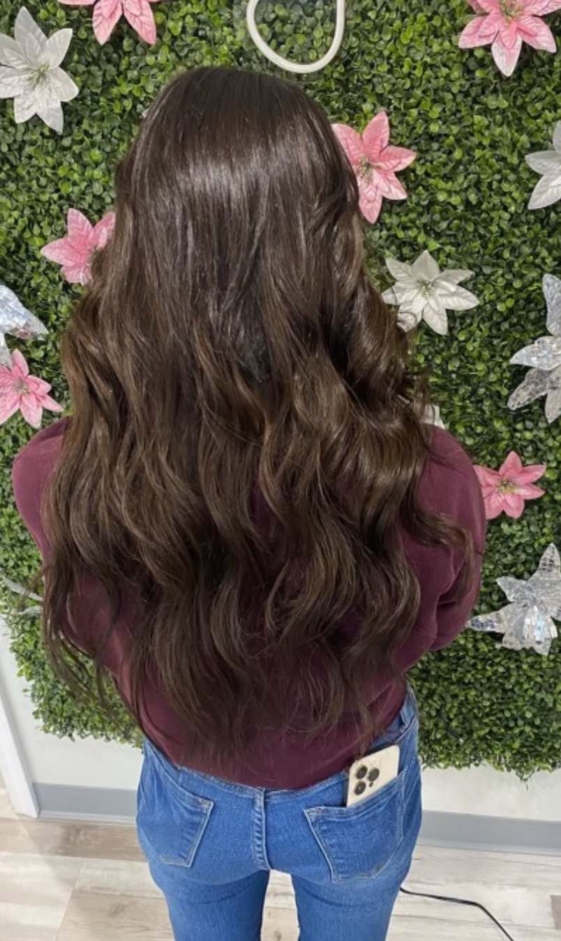 a woman wearing keratin tip hair extensions
