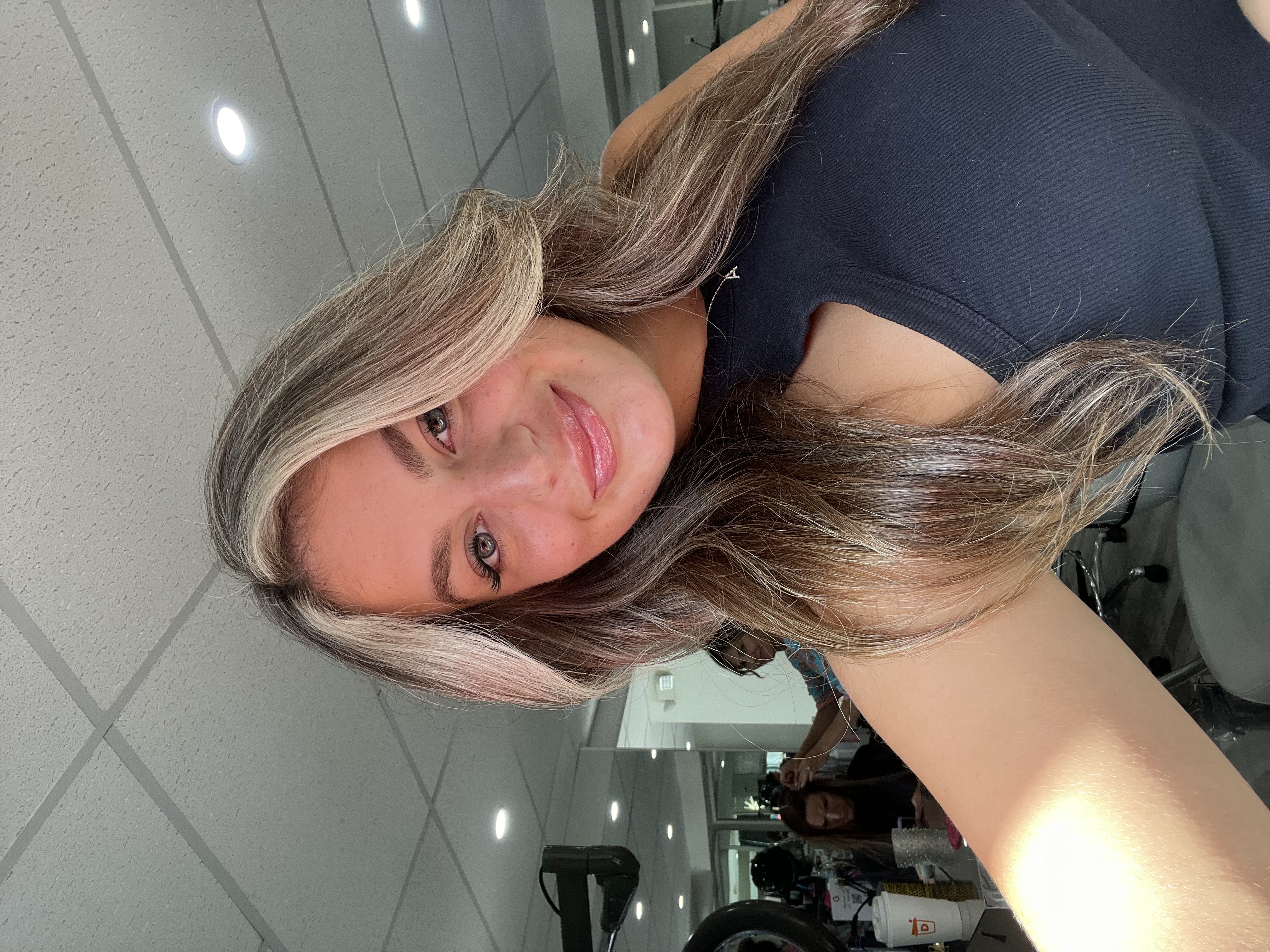a young woman with a partial balayage