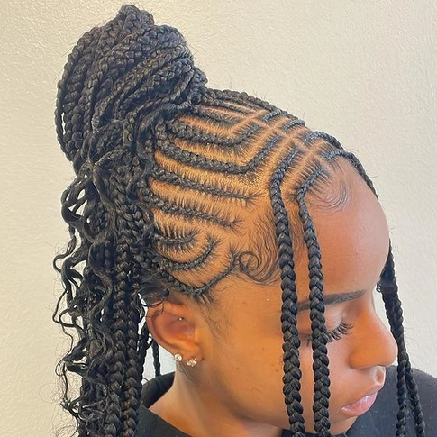 A black woman wearing sincerely4u's Tribal Braids