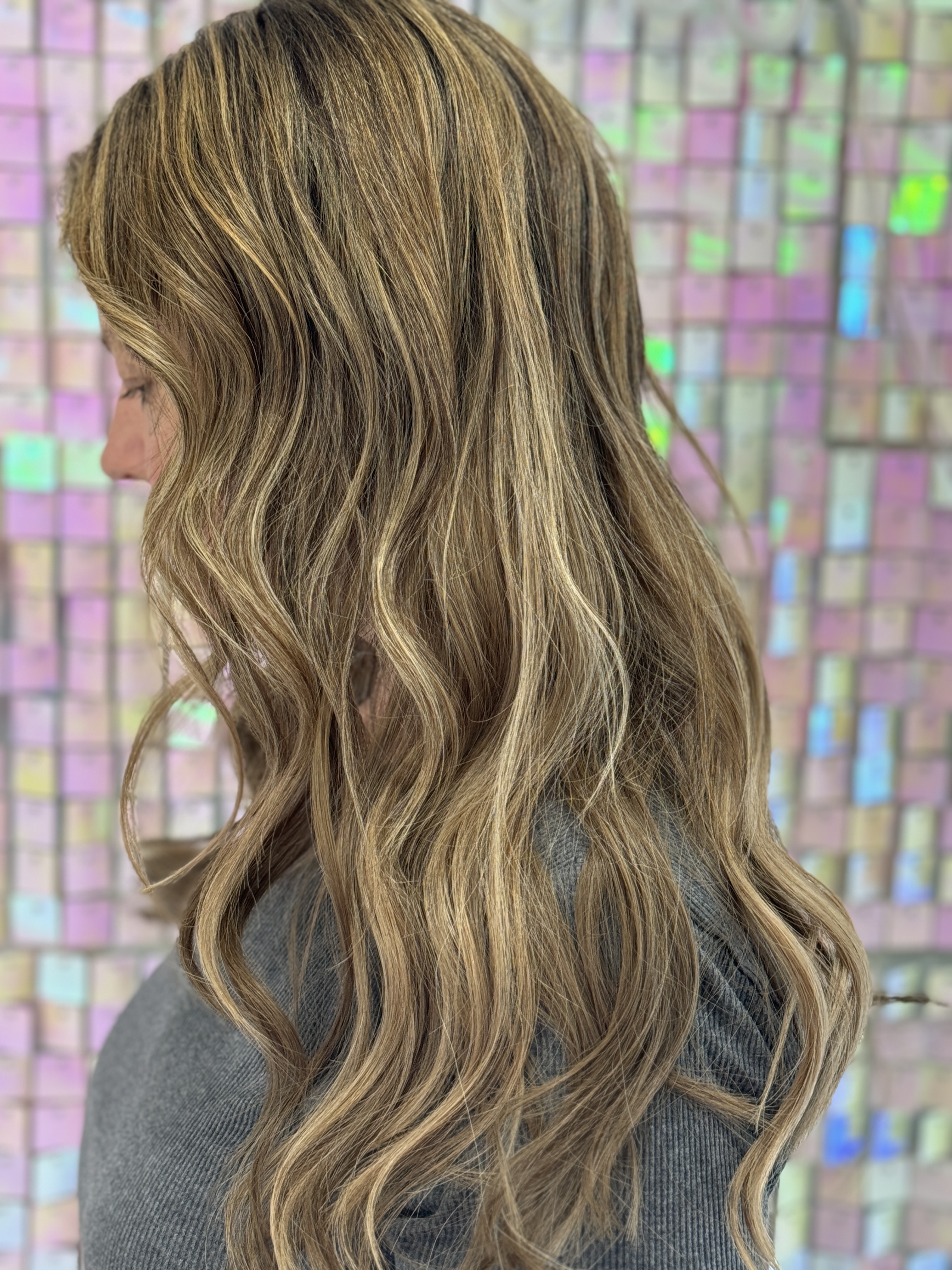 a woman wearing a wig gripper to create a natural looking hair line