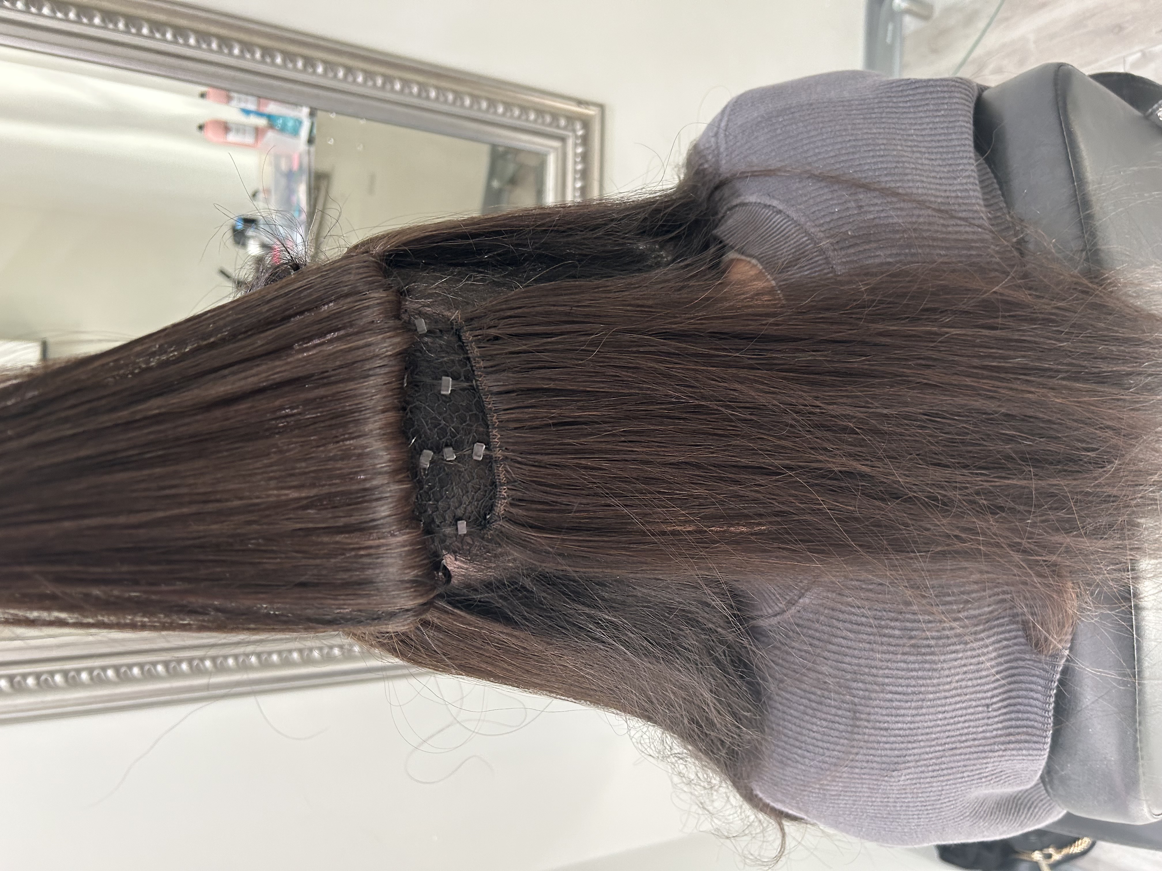 a close up look at a mesh integration hair system
