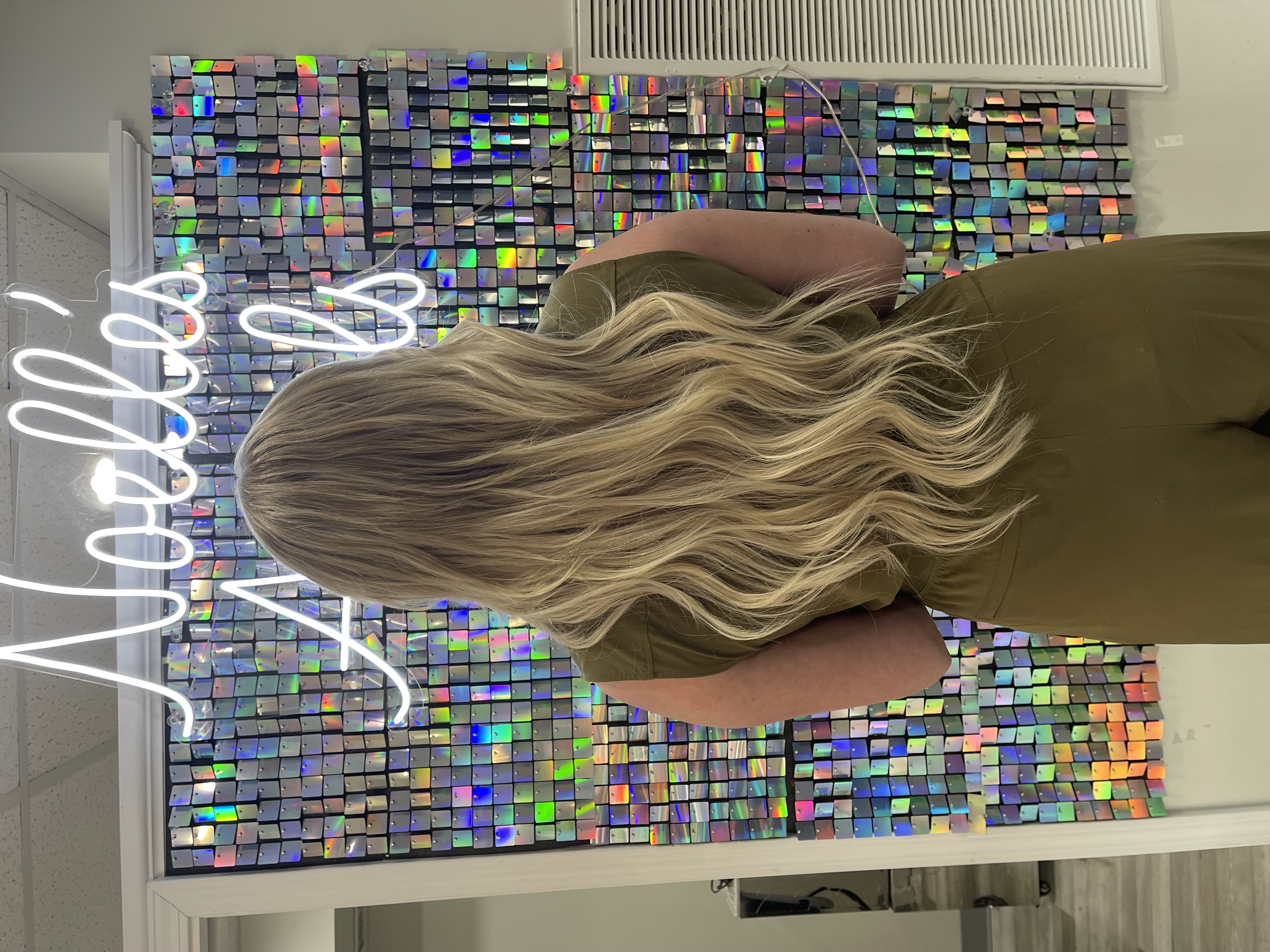 a woman with a medium blonde natural balayage