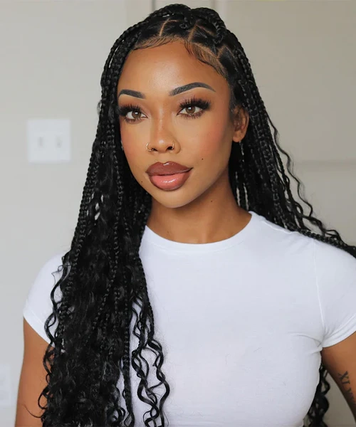 A black woman wearing sincerely4u's BohoGoddess Knotless Braids