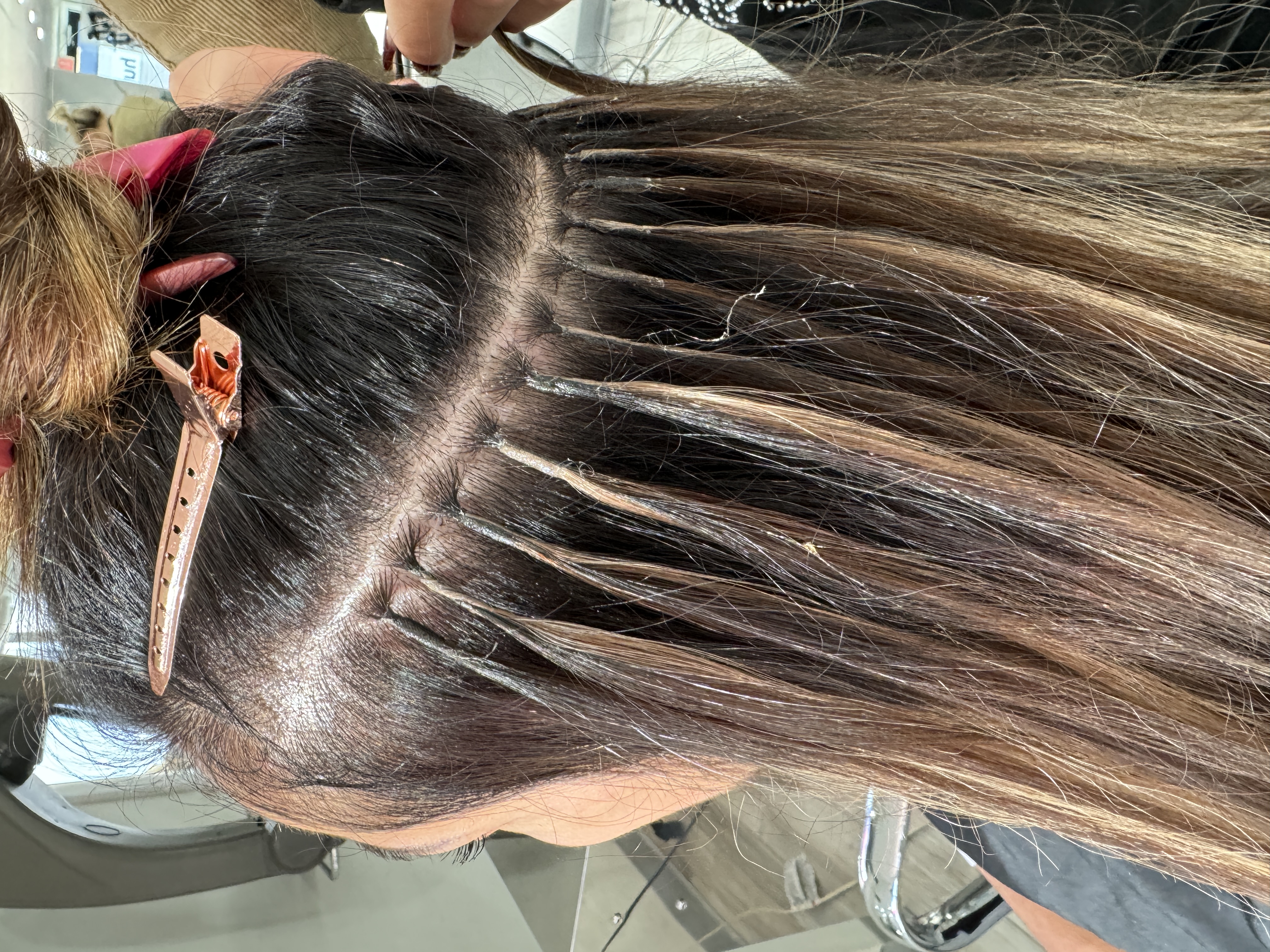 carefully attached hair extensions at Noelle Salon by Noelle Spinosa