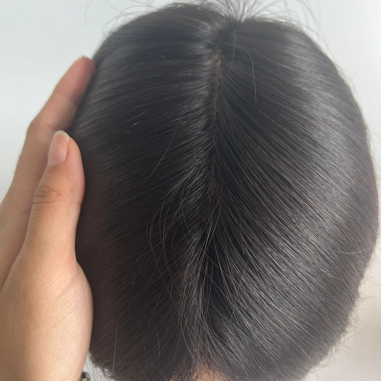 wearing a hair topper creates a barrier to prevent hair-pulling