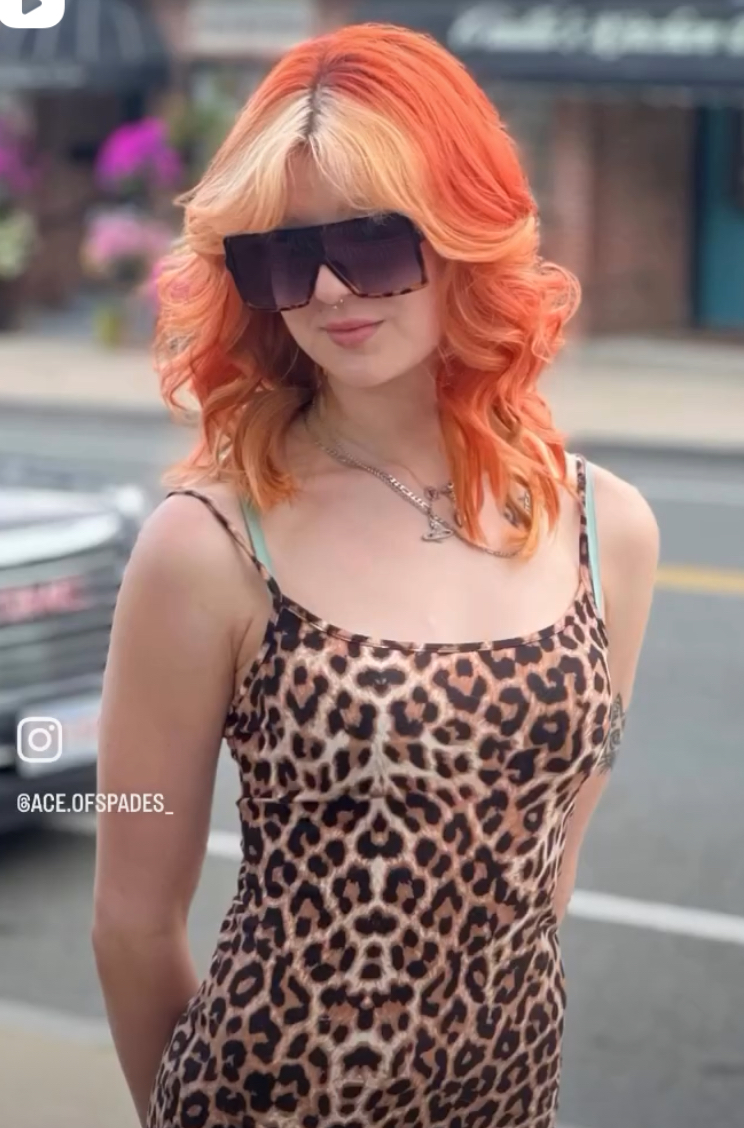a woman wearing a halo hair topper with bangs
